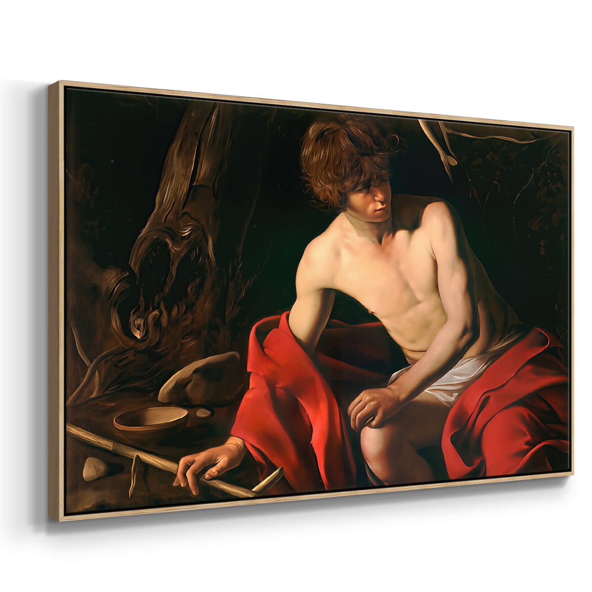 Angled view of Saint John the Baptist in the Wilderness, c. 1603-1604 by Caravaggio in a natural wood floater framed canvas.