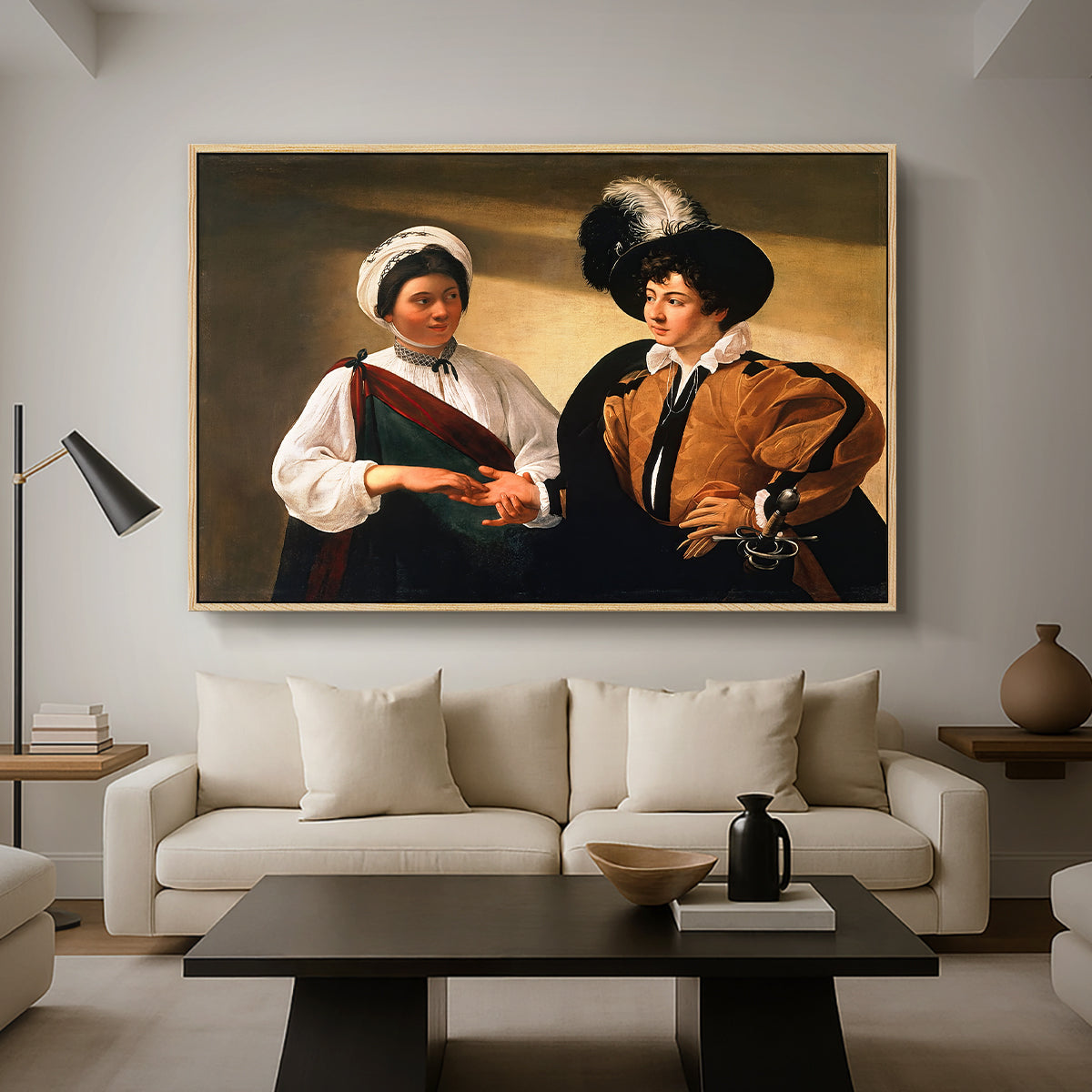 The Fortune Teller (Louvre Version), c. 1595 by Caravaggio as a natural wood floater framed canvas featuring a woman reading a young man's palm while secretly stealing his ring, displayed above a sofa in a modern living room.