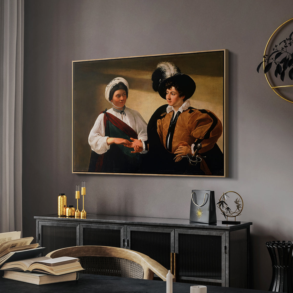 The Fortune Teller (Louvre Version), c. 1595 by Caravaggio in a natural wood floater framed canvas featuring an intimate scene of palm reading with subtle act of theft, displayed above a desk in a dark home office interior.