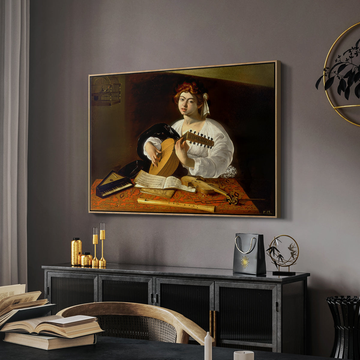 The Lute Player (Wildenstein Version), c. 1596 by Caravaggio in a natural wood floater framed canvas featuring a detailed scene of youth playing string instrument with fruit and flowers nearby, displayed above a desk in a dark home office interior.