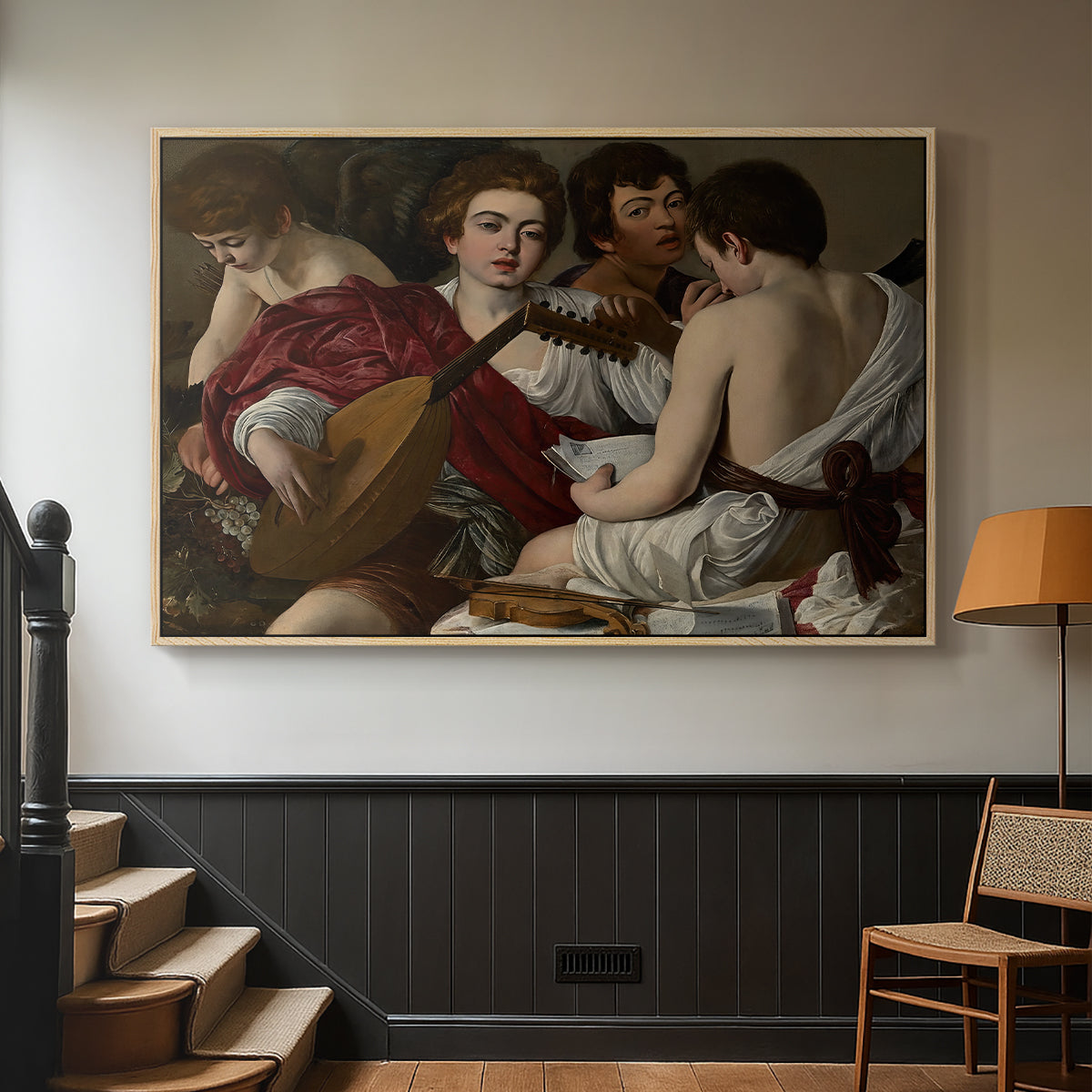 Natural wood floater framed canvas featuring a musical gathering with figures posed closely in soft light, displayed in a hallway near a staircase.