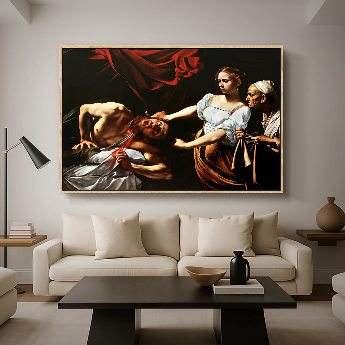 Judith Beheading Holofernes, c. 1599 by Caravaggio as a natural wood floater framed canvas featuring Judith cutting off Holofernes' head as maidservant assists beside her, displayed above a sofa in a modern living room.