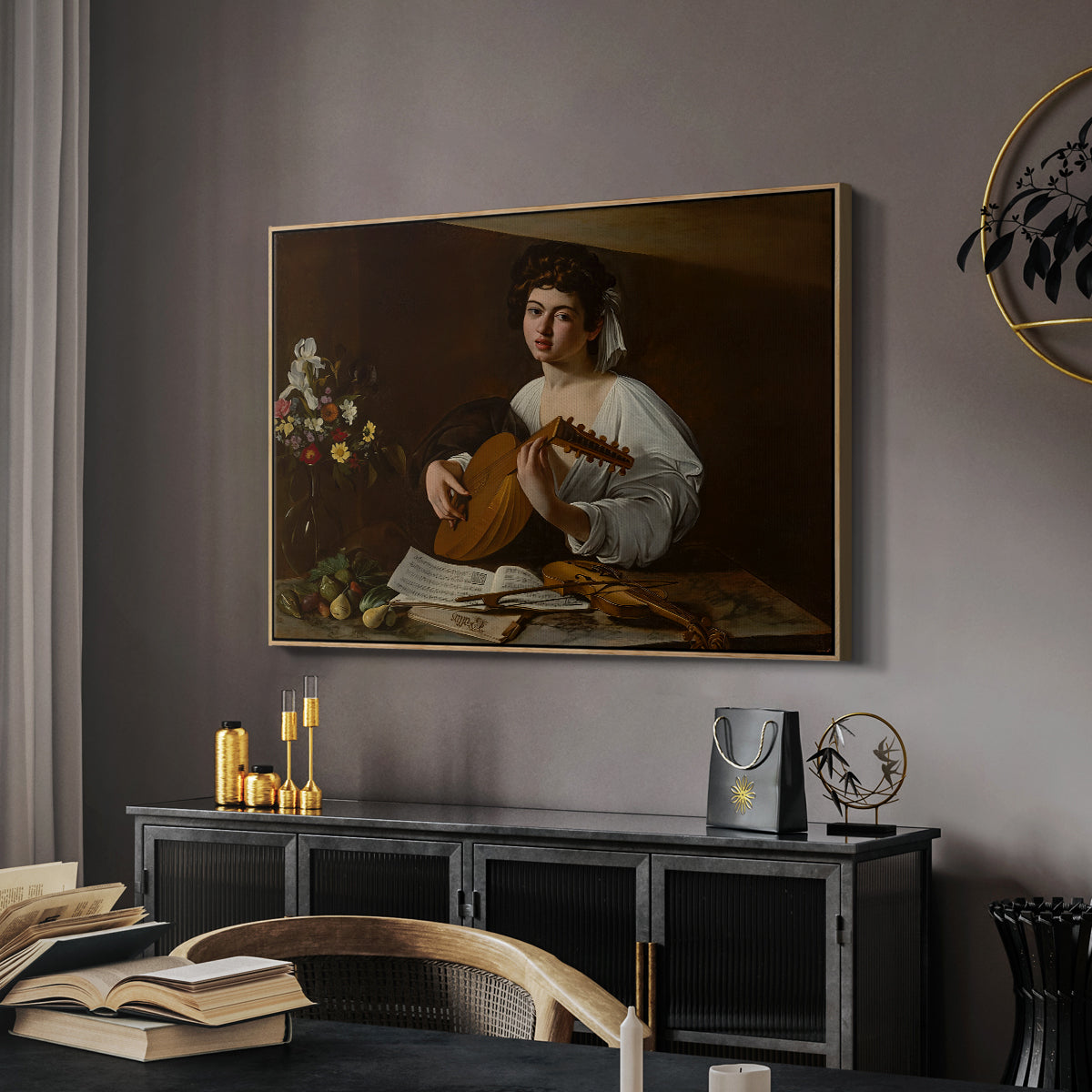 The Lute Player (Hermitage Version), c. 1596 by Caravaggio in a natural wood floater framed canvas featuring an intimate musical scene with instrument and decorative objects, displayed above a desk in a dark home office interior.
