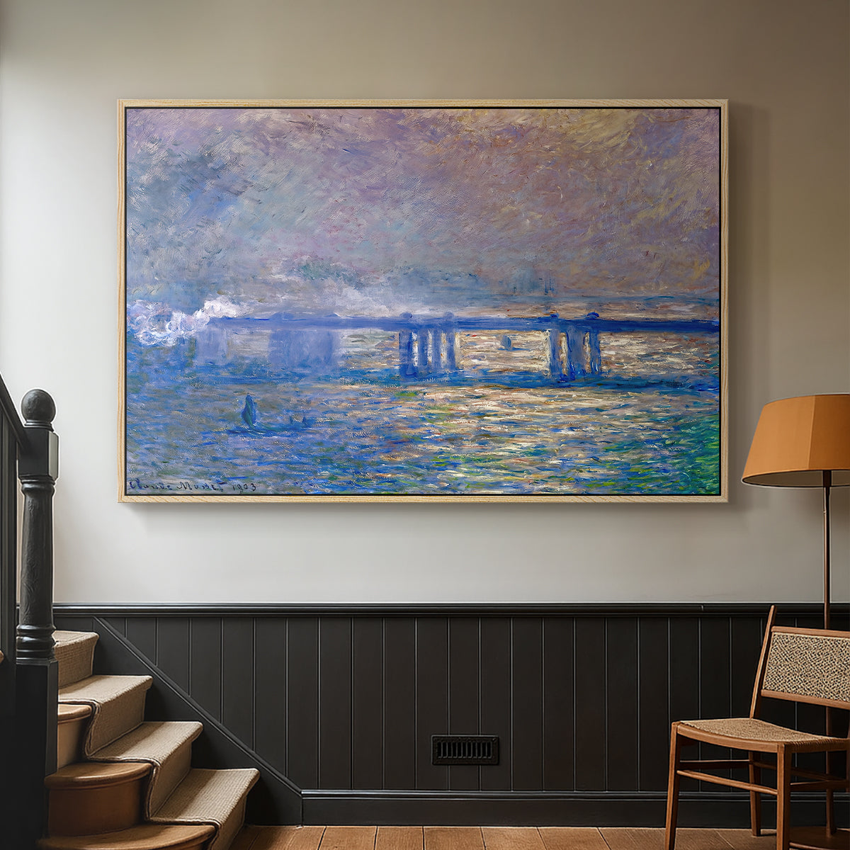 Natural wood floater framed canvas featuring a city bridge scene softened by mist and impressionist brushwork, displayed in a hallway near a staircase.