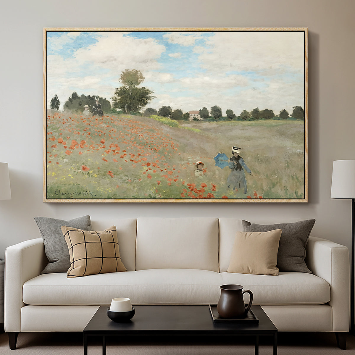 The Poppy Field near Argenteuil, 1873 by Claude Monet displayed in a natural wood floater framed canvas above a sofa in a clean living room.