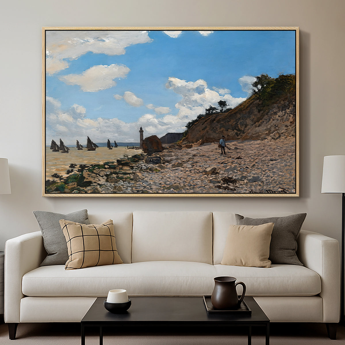 The Beach at Honfleur, 1864 by Claude Monet displayed in a natural wood floater framed canvas above a sofa in a clean living room.