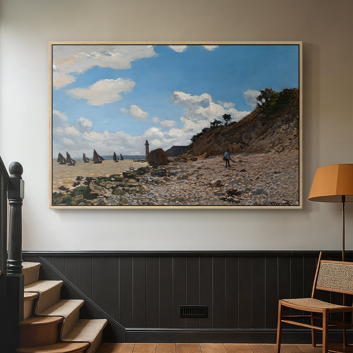 Natural wood floater framed canvas featuring a coastal landscape with boats and people along shore, displayed in a hallway near a staircase.