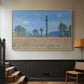 Natural wood floater framed canvas featuring a rural field filled with red blossoms beneath open sky, displayed in a hallway near a staircase.