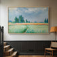 Natural wood floater framed canvas featuring a serene rural scene with textured wheat under natural light, displayed in a hallway near a staircase.