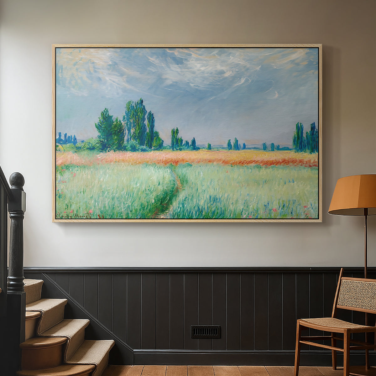 Natural wood floater framed canvas featuring a serene rural scene with textured wheat under natural light, displayed in a hallway near a staircase.
