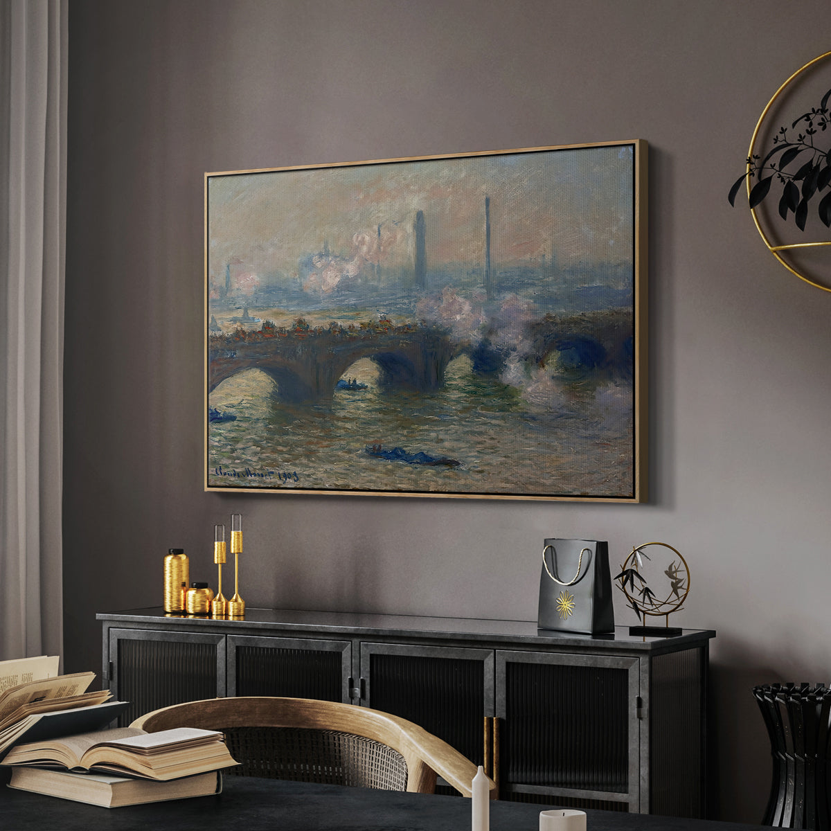 Waterloo Bridge, Gray Day, 1903 by Claude Monet in a natural wood floater framed canvas featuring a river and bridge scene with diffused light and urban backdrop, displayed above a desk in a dark home office interior.
