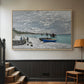 Natural wood floater framed canvas featuring an impressionist seaside gathering with flags and ocean view, displayed in a hallway near a staircase.