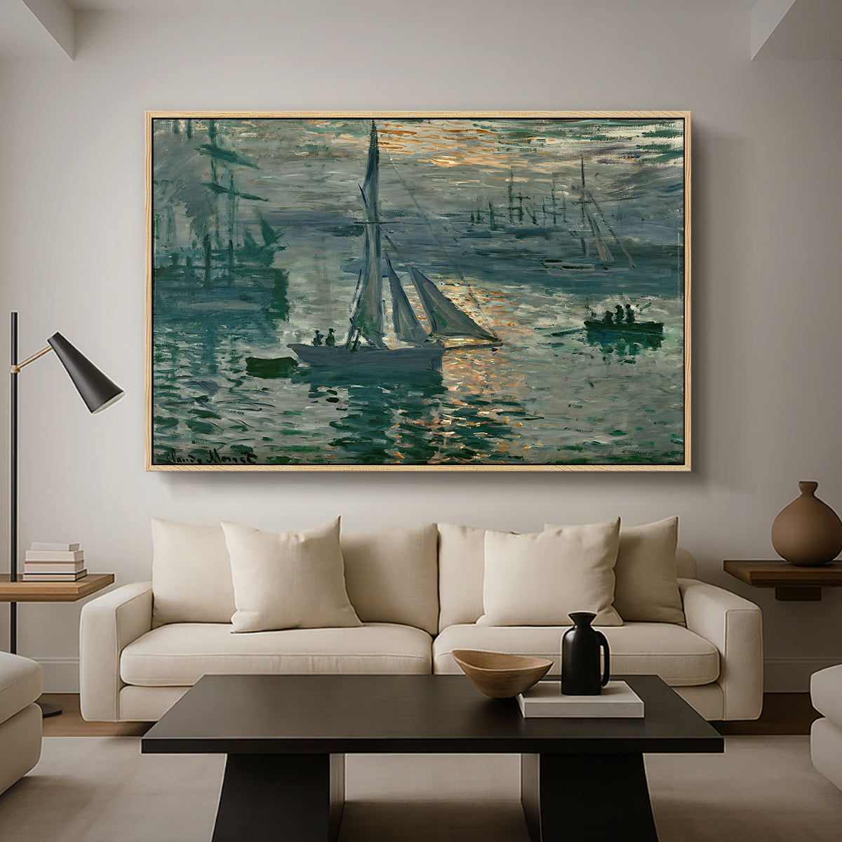 Sunrise (Marine), 1873 by Claude Monet as a natural wood floater framed canvas featuring a hazy sunrise over harbor with boats silhouetted in soft morning light, displayed above a sofa in a modern living room.