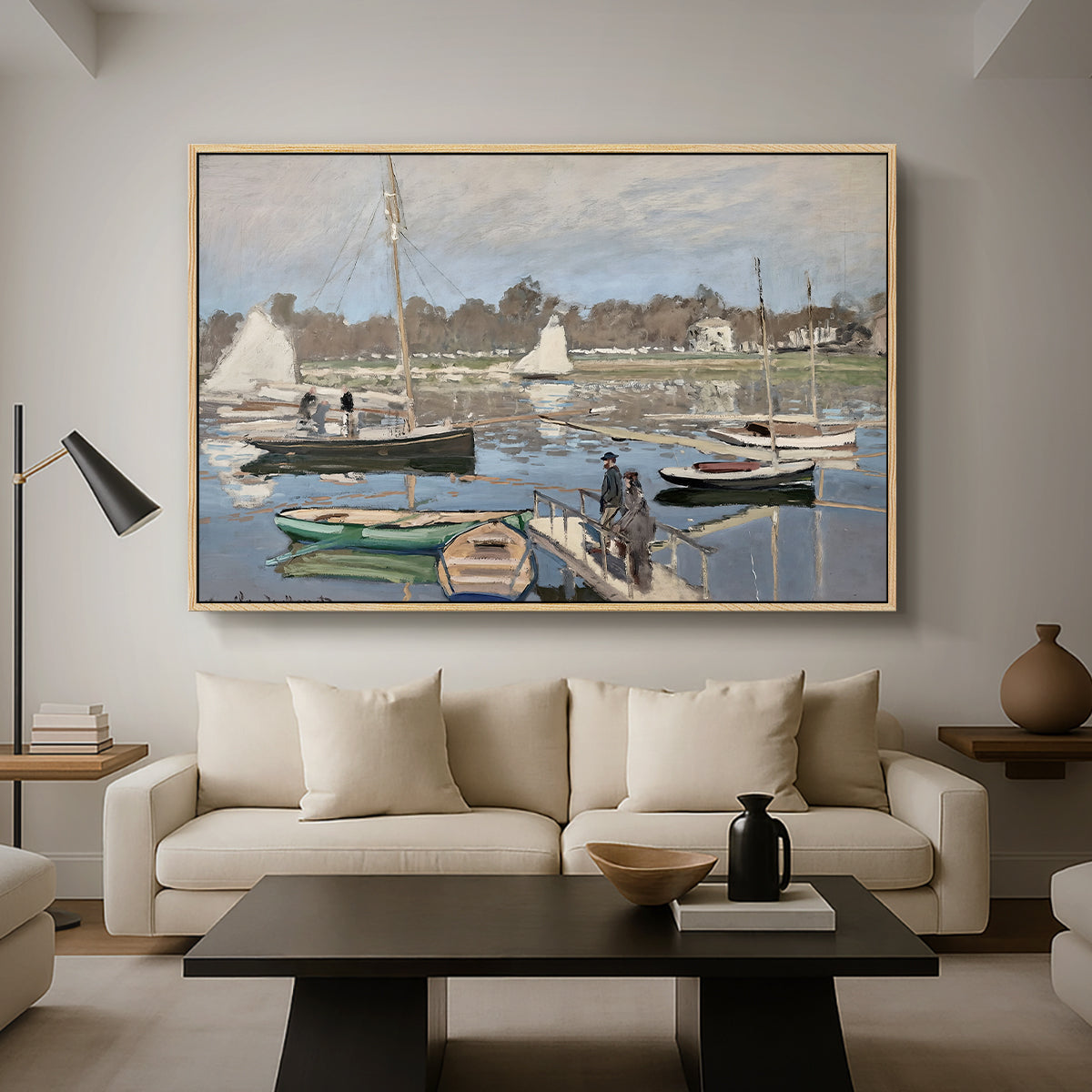 The Basin at Argenteuil, 1874 by Claude Monet as a natural wood floater framed canvas featuring sailboats gathered in calm basin with reflections on water, displayed above a sofa in a modern living room.