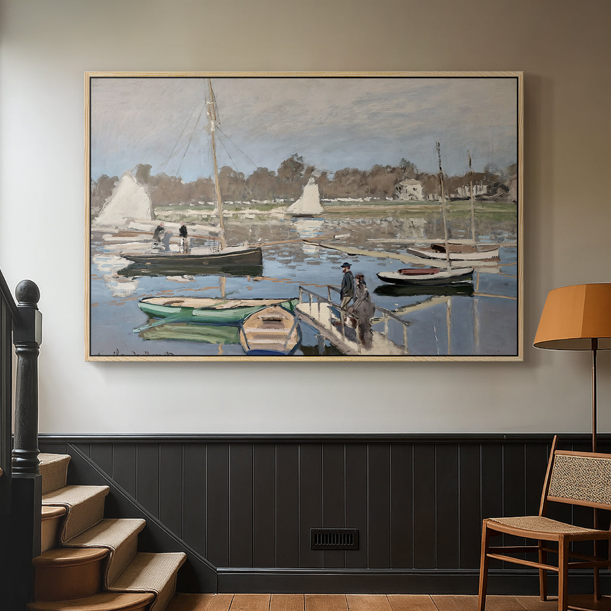 Natural wood floater framed canvas featuring a tranquil river setting with sailboats and shoreline, displayed in a hallway near a staircase.