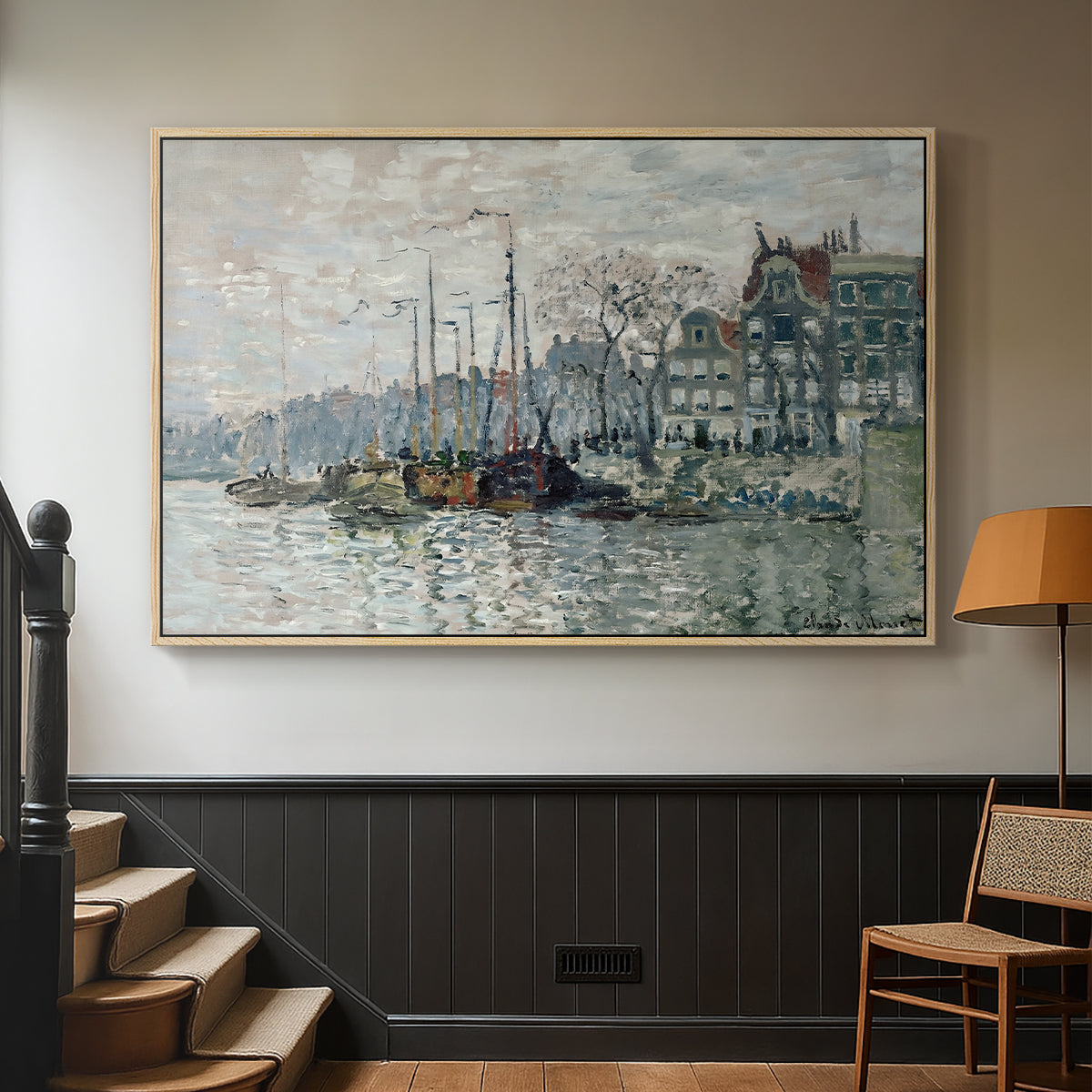 Natural wood floater framed canvas featuring a harbor view with masts, houses, and reflections in water, displayed in a hallway near a staircase.