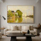 Houses on the Achterzaan, 1871 by Claude Monet as a natural wood floater framed canvas featuring colorful houses reflected in calm river surrounded by greenery, displayed above a sofa in a modern living room.