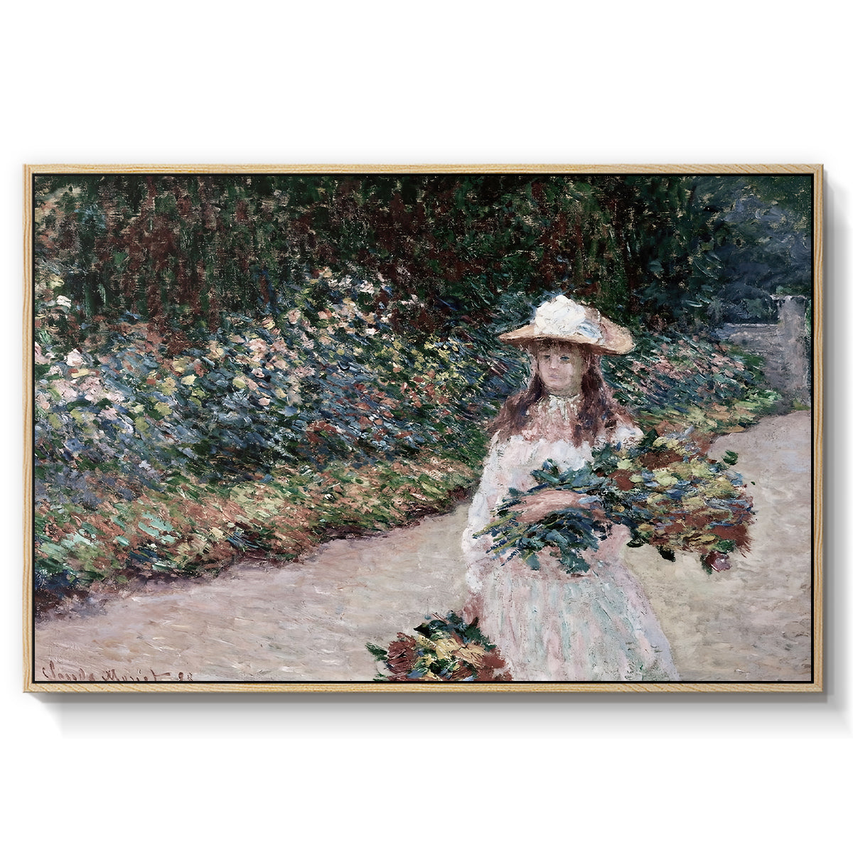 Young Girl in the Garden at Giverny, 1888 by Claude Monet in a natural wood floater framed canvas wall art display.