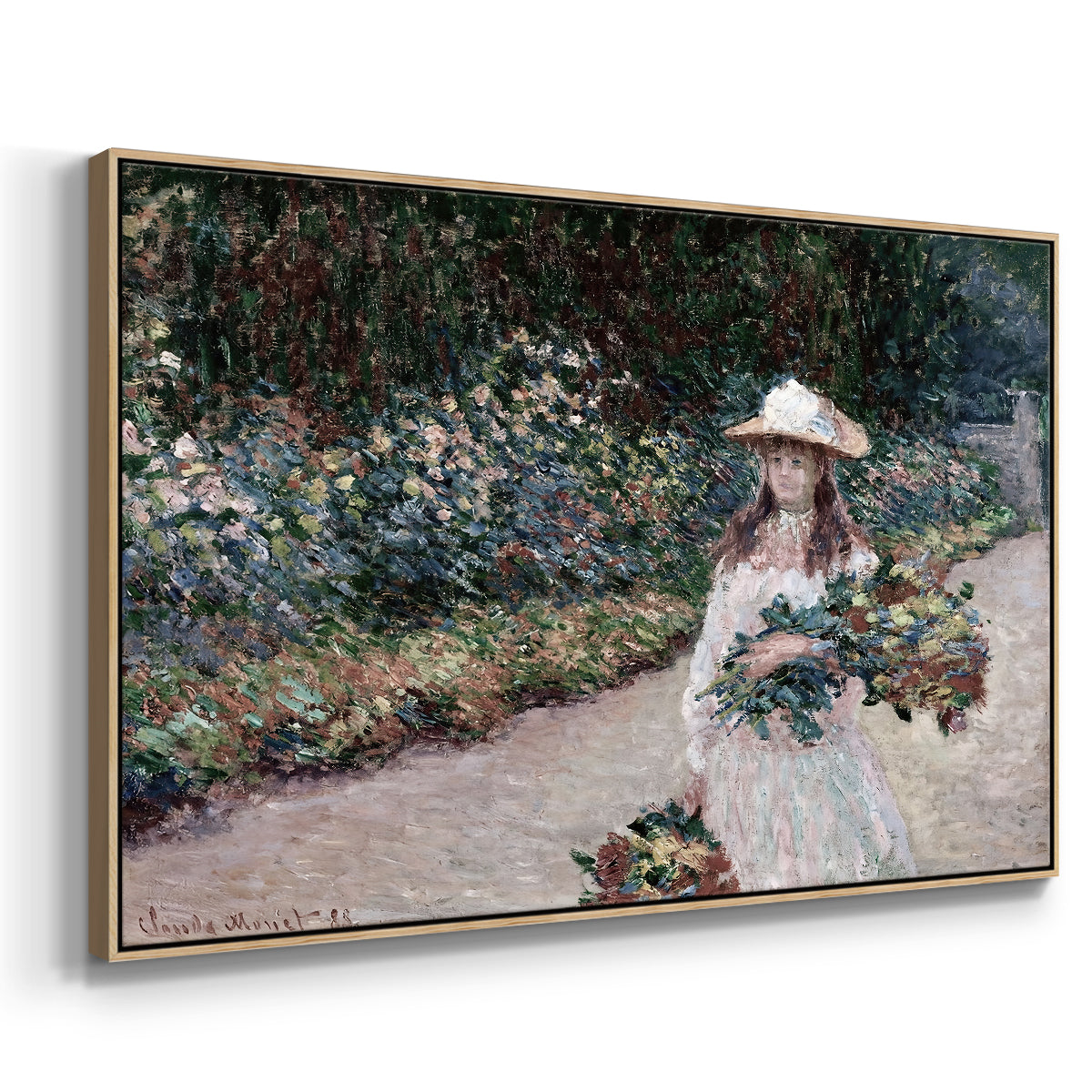 Angled view of Young Girl in the Garden at Giverny, 1888 by Claude Monet in a natural wood floater framed canvas.