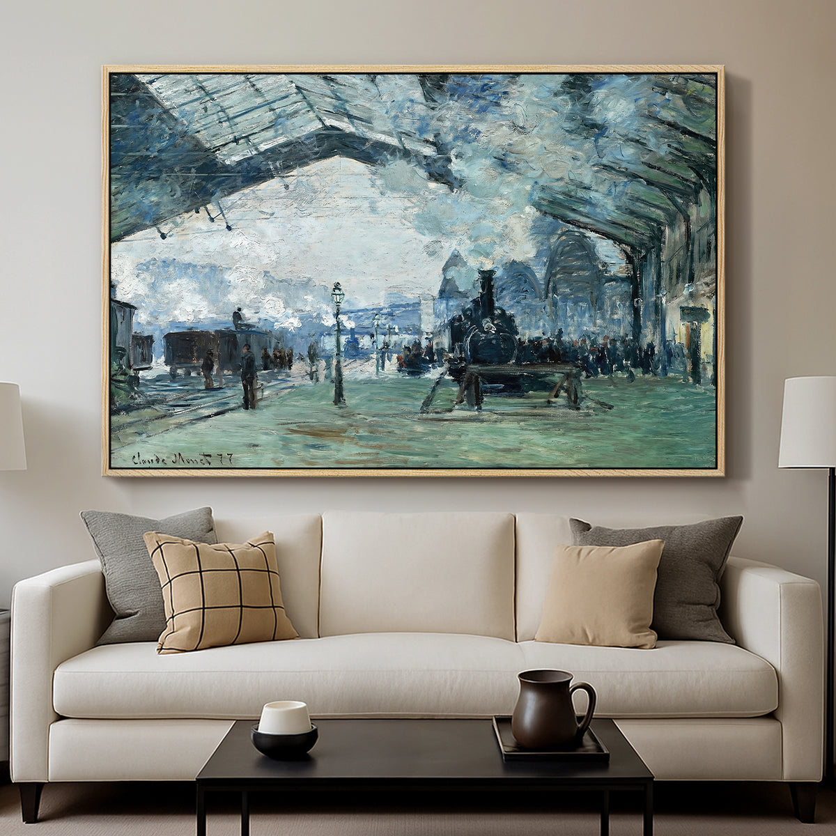 The Saint-Lazare Station, 1877 by Claude Monet displayed in a natural wood floater framed canvas above a sofa in a clean living room.