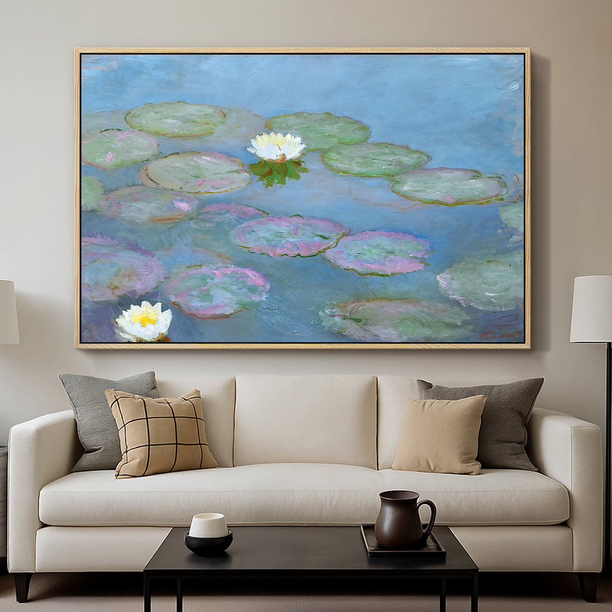 Water Lilies (Nymphéas), 1897-1899 by Claude Monet displayed in a natural wood floater framed canvas above a sofa in a clean living room.