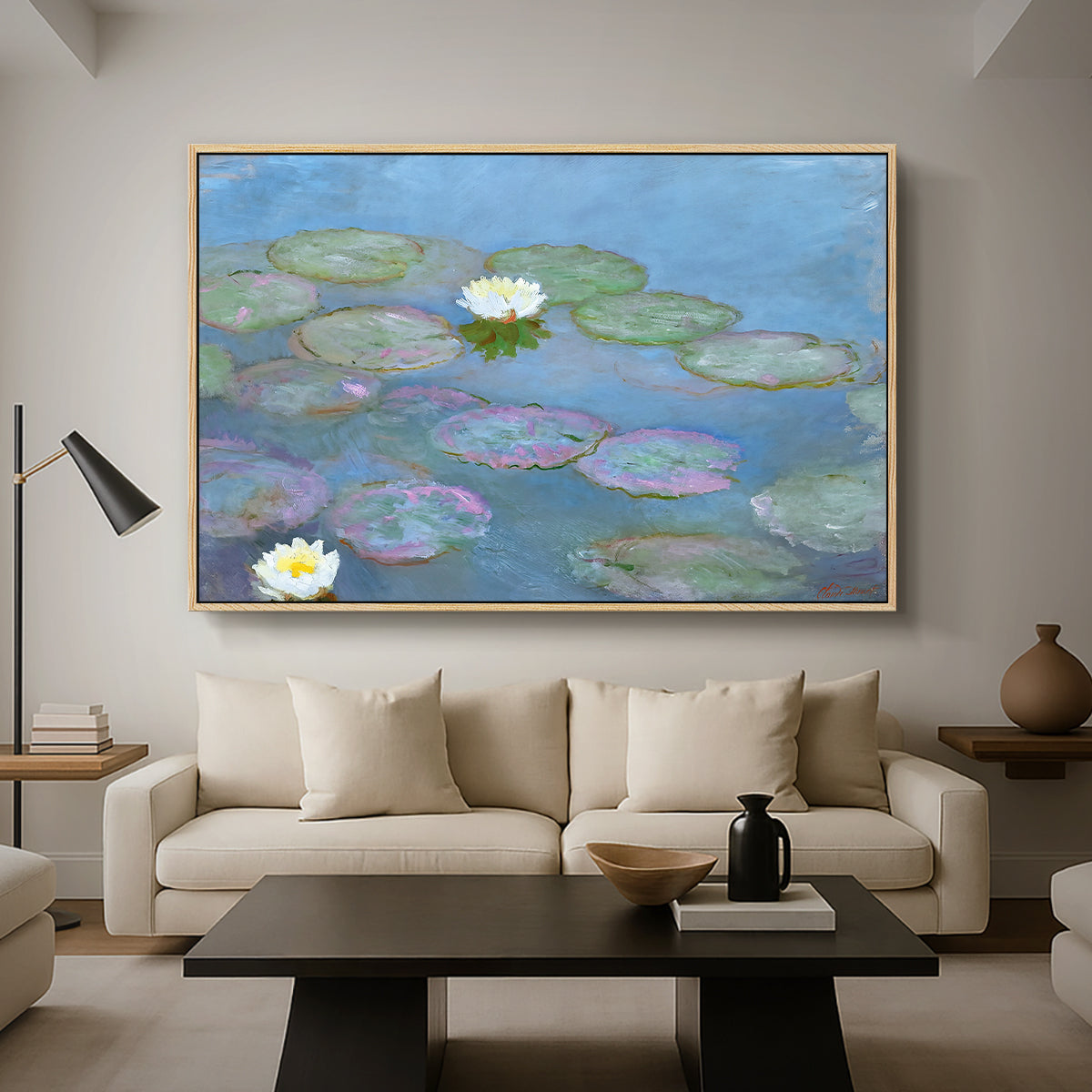 Water Lilies (Nymphéas), 1897-1899 by Claude Monet as a natural wood floater framed canvas featuring floating water lilies on pond with reflections of sky and foliage, displayed above a sofa in a modern living room.