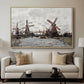 Windmills near Zaandam, 1871 by Claude Monet displayed in a natural wood floater framed canvas above a sofa in a clean living room.
