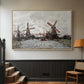 Natural wood floater framed canvas featuring a landscape featuring windmills and low horizon sky, displayed in a hallway near a staircase.