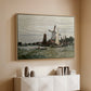 Natural wood floater framed canvas of Windmill at Zaandam, 1871 by Claude Monet, featuring an impressionist depiction of windmill near riverbank above a console cabinet in a minimalist entryway.