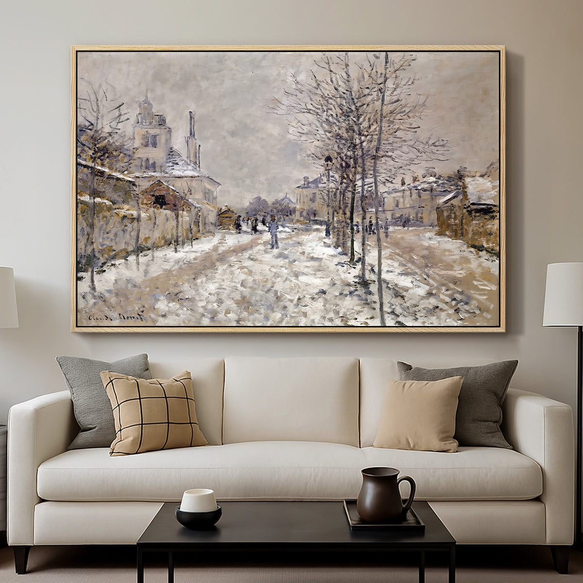 The Boulevard de Pontoise at Argenteuil, Snow Effect, 1875 by Claude Monet displayed in a natural wood floater framed canvas above a sofa in a clean living room.