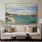 Regatta at Sainte-Adresse, 1867 by Claude Monet displayed in a natural wood floater framed canvas above a sofa in a clean living room.