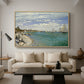 Regatta at Sainte-Adresse, 1867 by Claude Monet as a natural wood floater framed canvas featuring sailboats gathered near shore with flags and spectators along coastline, displayed above a sofa in a modern living room.