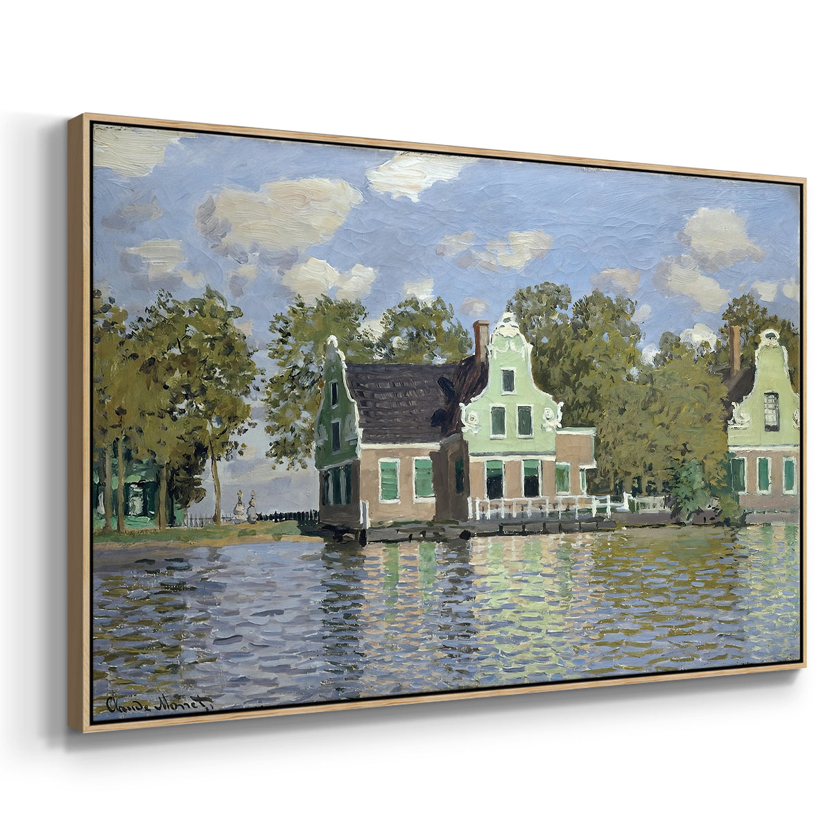 Angled view of Houses on the Zaan River at Zaandam, 1871 by Claude Monet in a natural wood floater framed canvas.