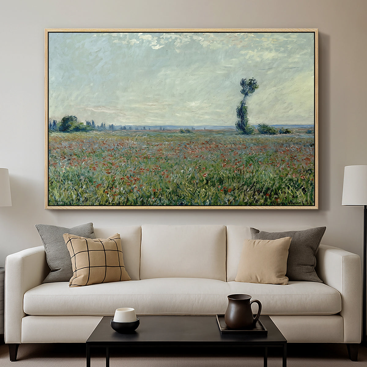 Poppy Field, 1881 by Claude Monet displayed in a natural wood floater framed canvas above a sofa in a clean living room.