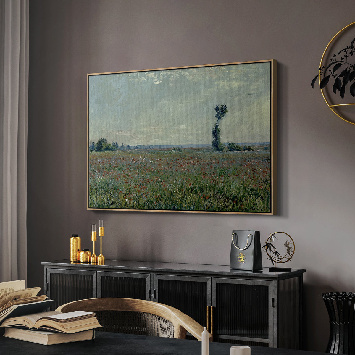 Poppy Field, 1881 by Claude Monet in a natural wood floater framed canvas featuring a rural meadow with scattered poppies and soft horizon, displayed above a desk in a dark home office interior.