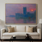 The Houses of Parliament, Sunset, 1903 by Claude Monet displayed in a natural wood floater framed canvas above a sofa in a clean living room.