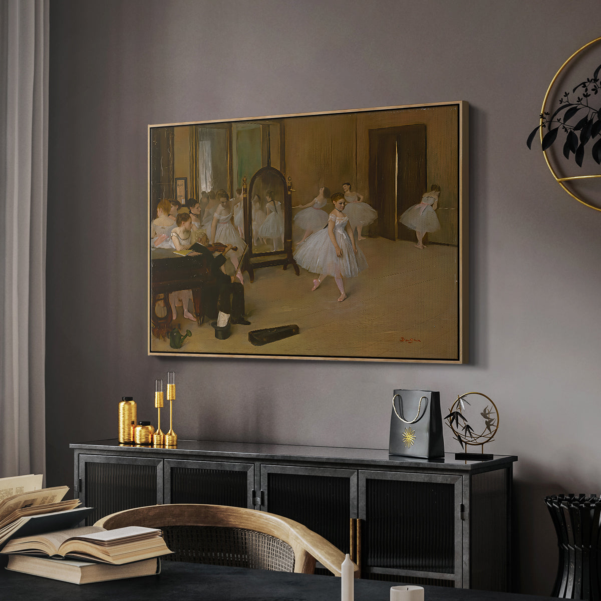 The Dancing Class, c. 1870 by Edgar Degas in a natural wood floater framed canvas featuring an impressionist interior capturing movement and discipline of dancers, displayed above a desk in a dark home office interior.