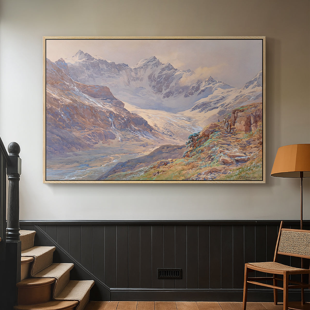 Natural wood floater framed canvas featuring an expansive alpine view with ice and distant mountains, displayed in a hallway near a staircase.