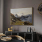 The Großglockner from the Prager Hut, 1890 by Edward Theodore Compton in a natural wood floater framed canvas featuring an alpine vista with towering peak and foreground terrain, displayed above a desk in a dark home office interior.