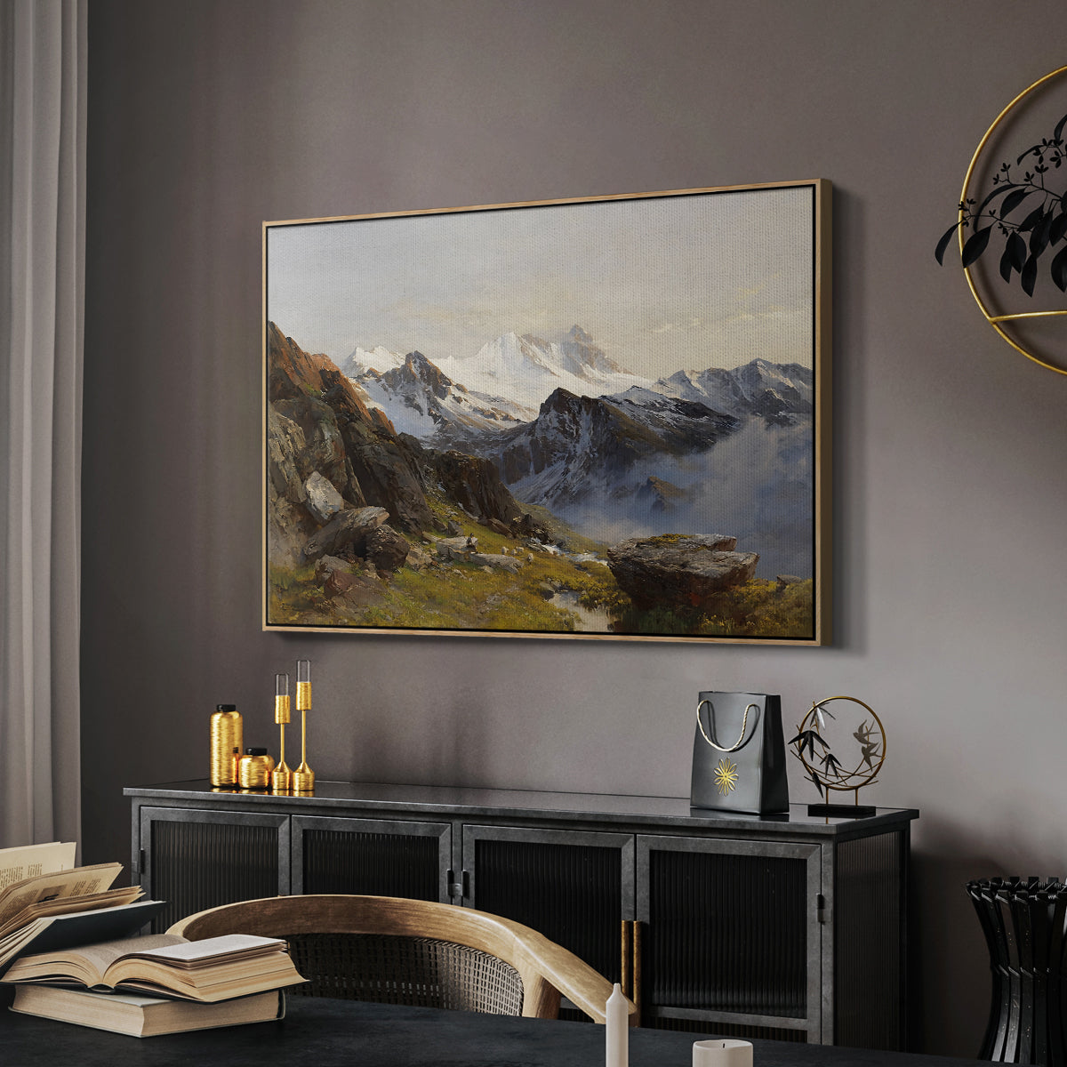 The Großglockner from the Prager Hut, 1890 by Edward Theodore Compton in a natural wood floater framed canvas featuring an alpine vista with towering peak and foreground terrain, displayed above a desk in a dark home office interior.