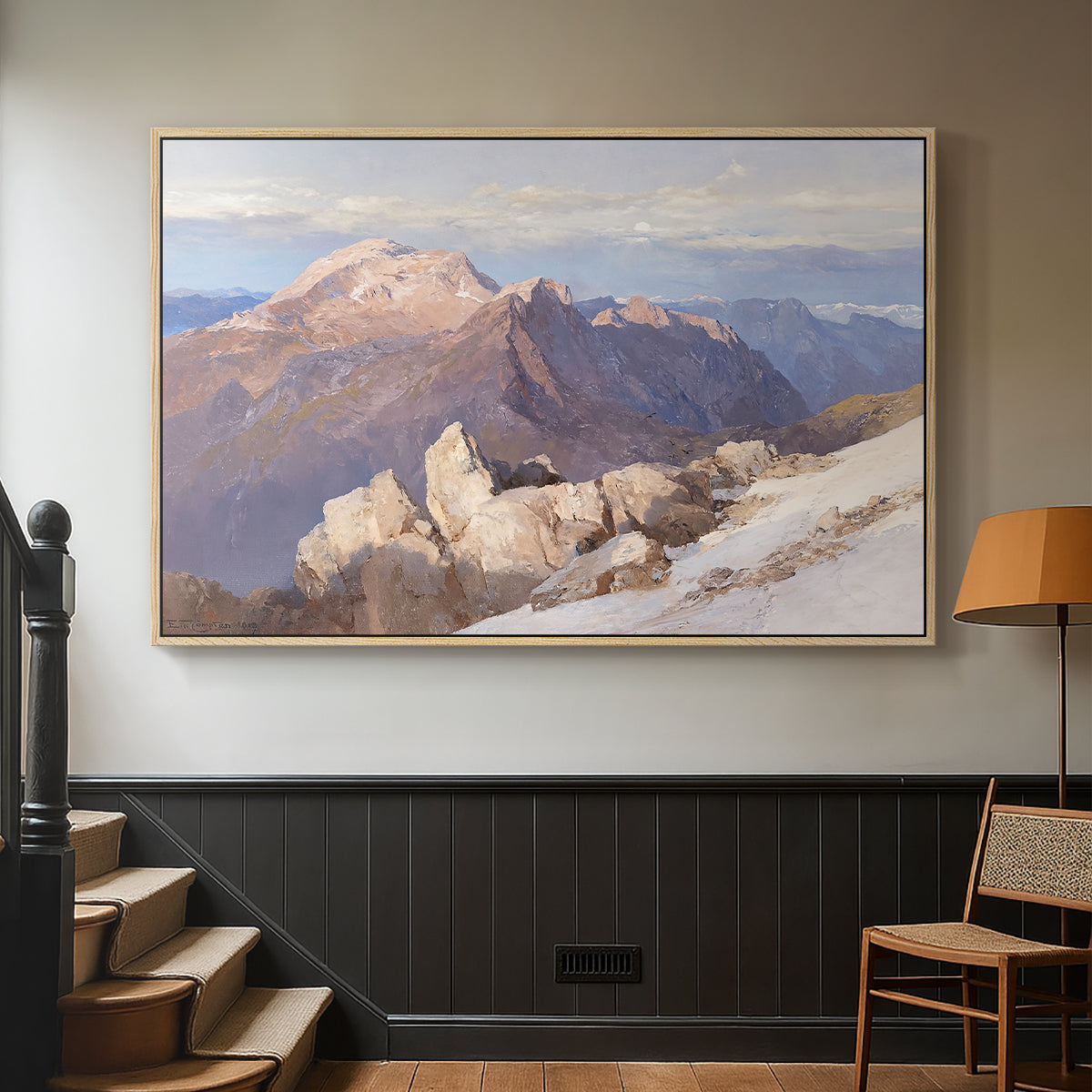 Natural wood floater framed canvas featuring an expansive mountainous landscape with natural depth, displayed in a hallway near a staircase.
