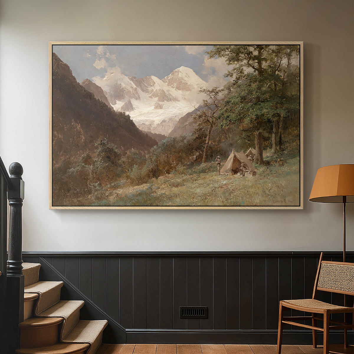 Natural wood floater framed canvas featuring a realistic depiction of remote mountain environment, displayed in a hallway near a staircase.