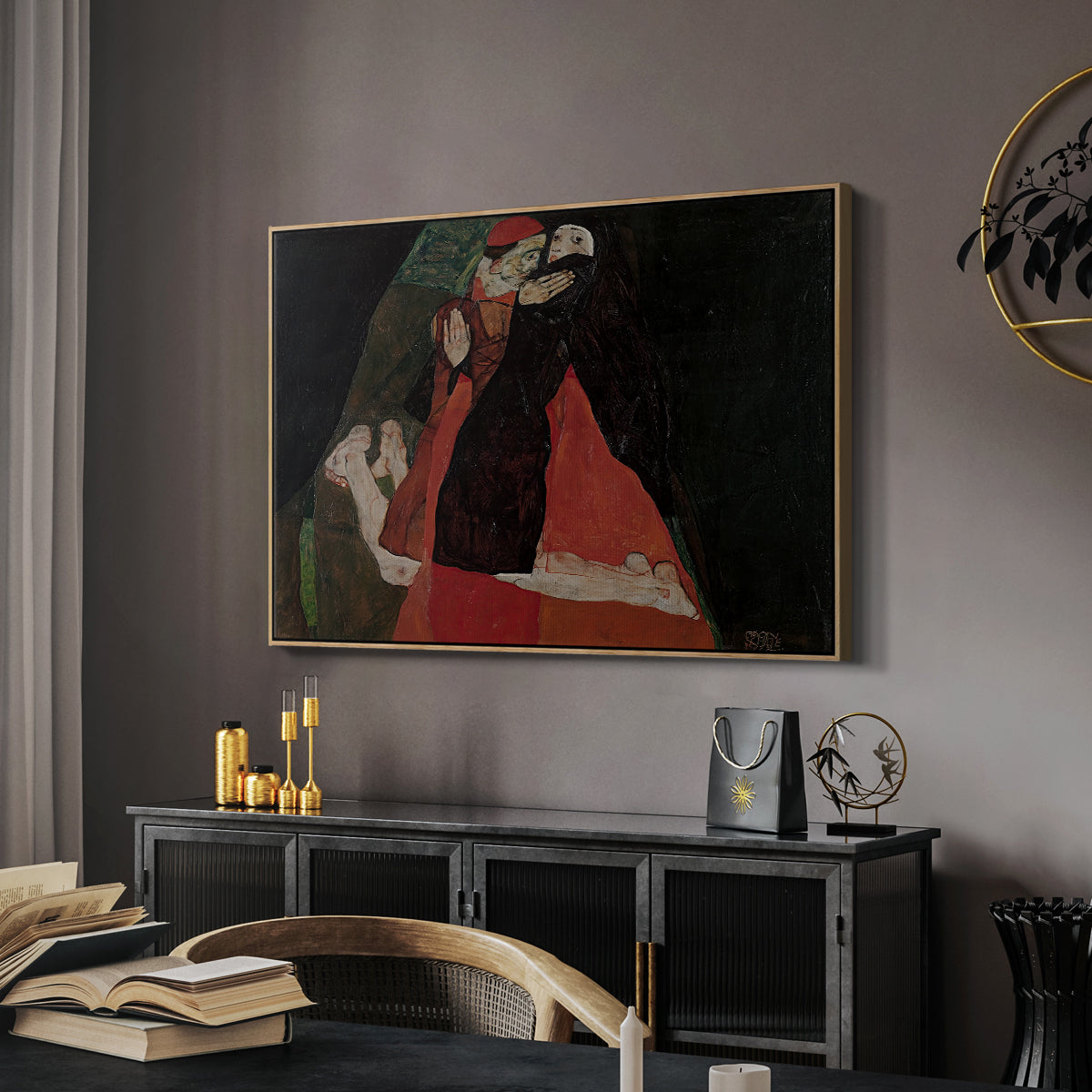 Cardinal and Nun (Caress), 1912 by Egon Schiele in a natural wood floater framed canvas featuring an expressive painting of figures entwined with bold lines and color, displayed above a desk in a dark home office interior.