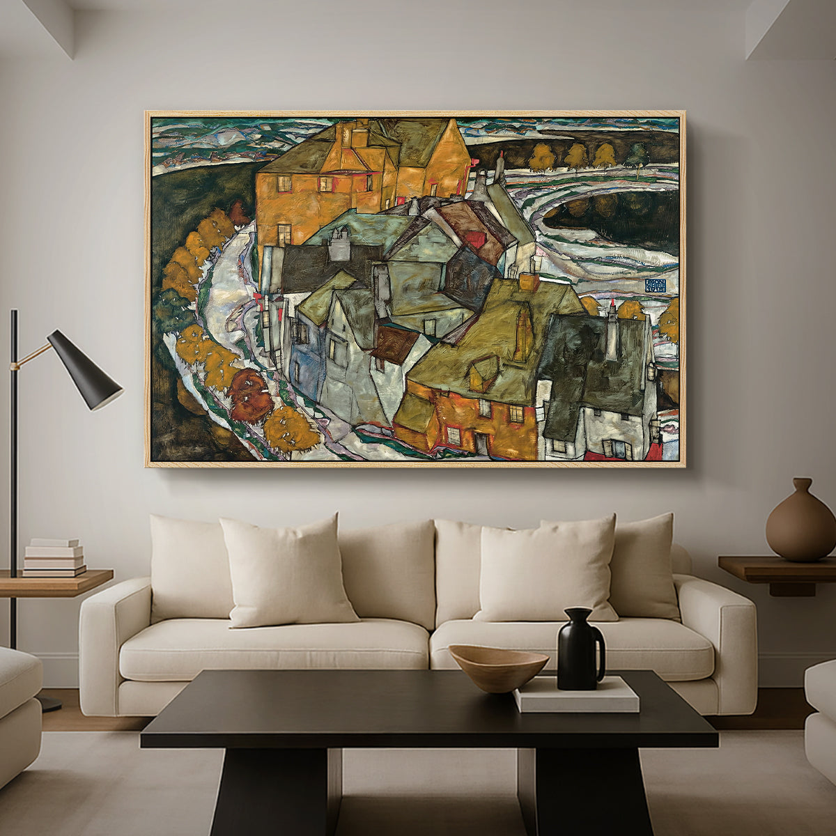 Crescent of Houses II (Island Town), 1915 by Egon Schiele as a natural wood floater framed canvas featuring a curved row of colorful houses forming crescent shape along water, displayed above a sofa in a modern living room.