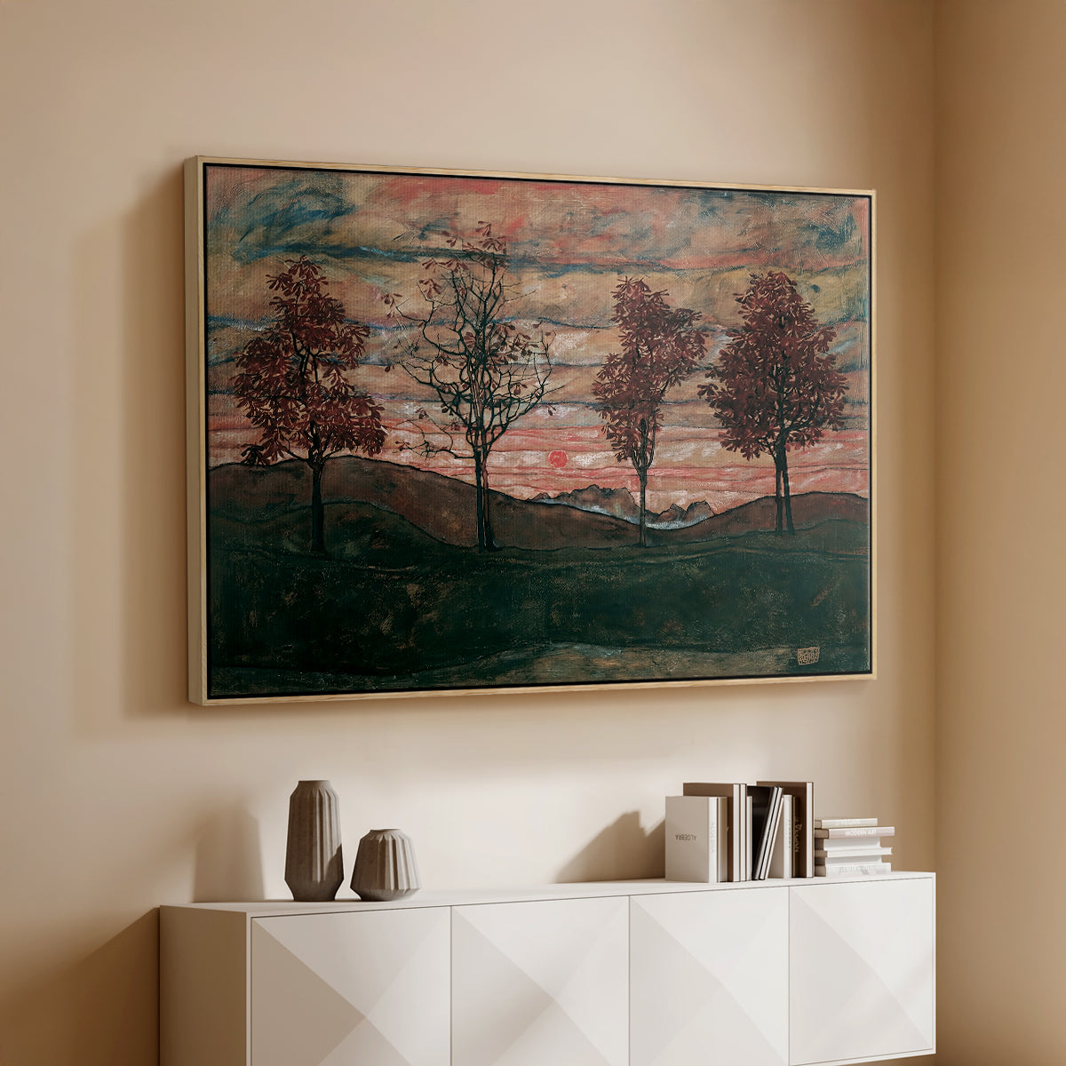 Natural wood floater framed canvas of Four Trees, 1917 by Egon Schiele, featuring a minimal landscape with grouped trees and expressive color above a console cabinet in a minimalist entryway.
