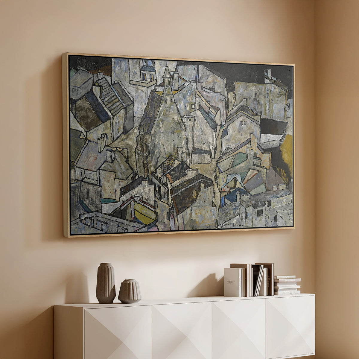 Natural wood floater framed canvas of Mödling II, 1918 by Egon Schiele, featuring an expressionist cityscape with tightly packed buildings and bold lines above a console cabinet in a minimalist entryway.