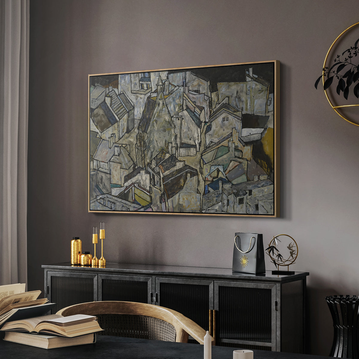 Mödling II, 1918 by Egon Schiele in a natural wood floater framed canvas featuring an abstracted town view with angular rooftops and fragmented forms, displayed above a desk in a dark home office interior.