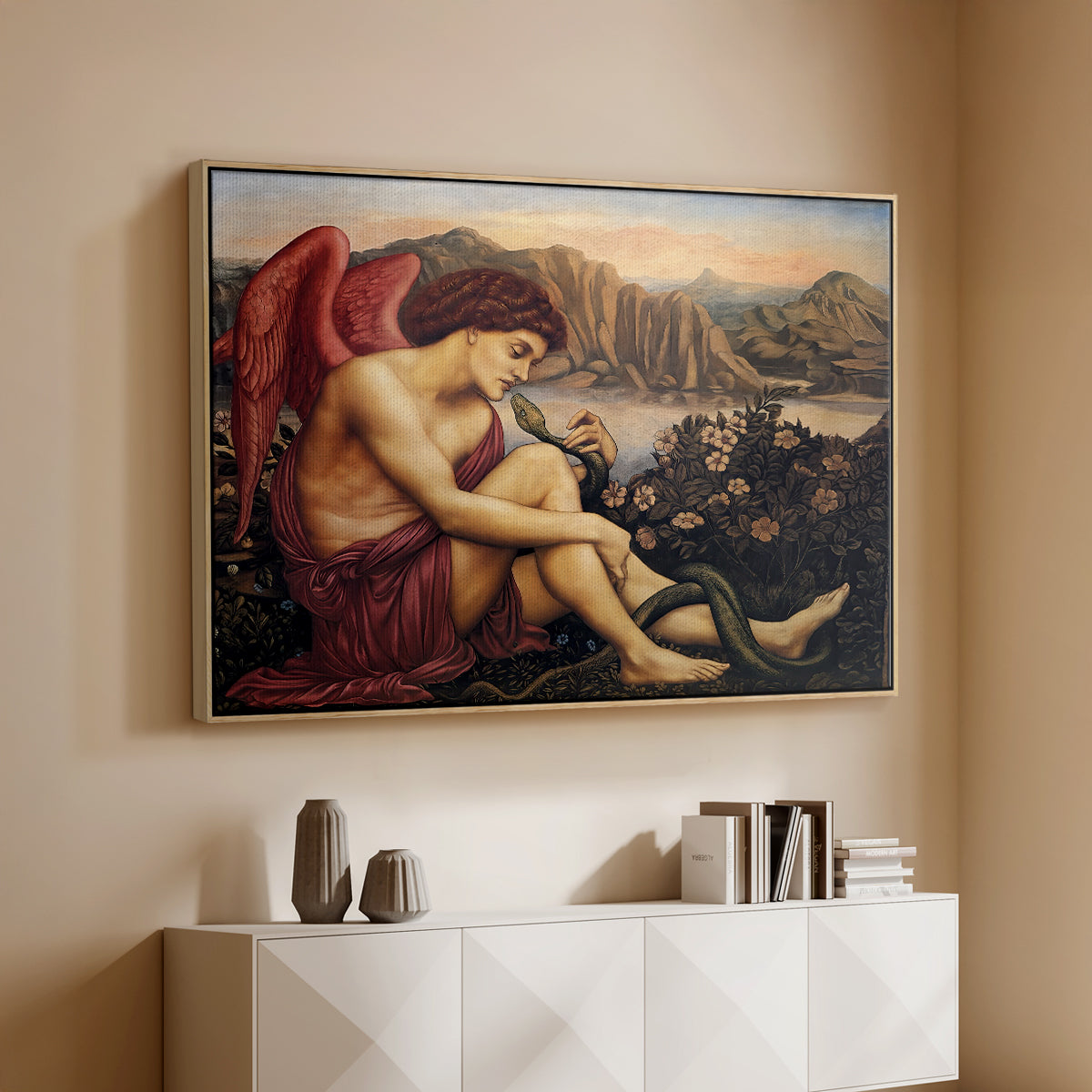 Natural wood floater framed canvas of The Angel with the Serpent, c. 1870-1875 by Evelyn De Morgan, featuring a winged figure standing over serpent in allegorical composition above a console cabinet in a minimalist entryway.