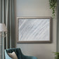Zen-inspired minimalist abstract frond artwork in an ornate vintage silver frame displayed in a neutral interior setting.
